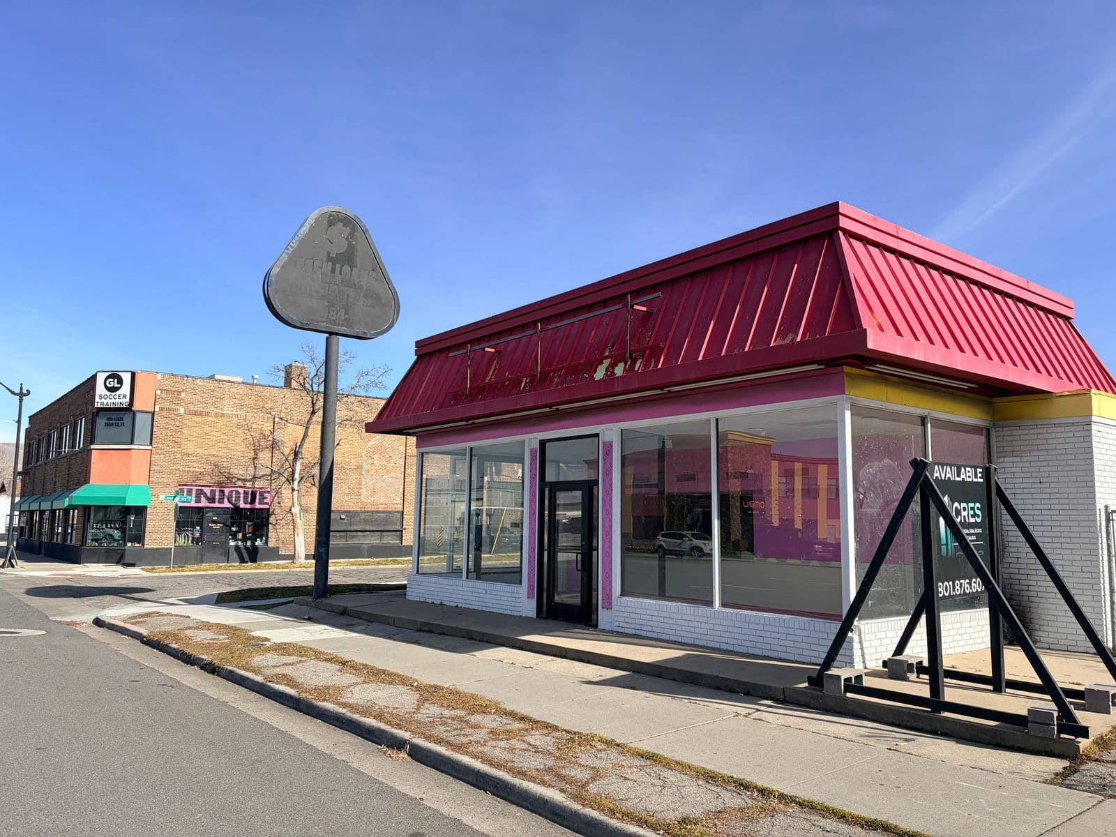 Freestanding retail building with red mansard roof at 1445 South State Street in Salt Lake City