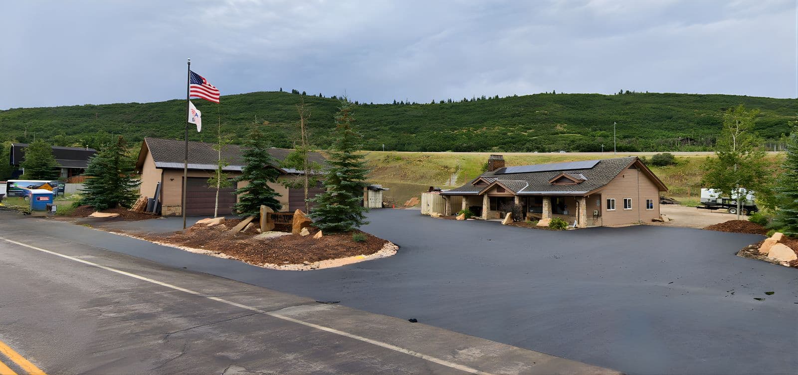 Lodge style building with pond at 155 Aspen Drive in Park City