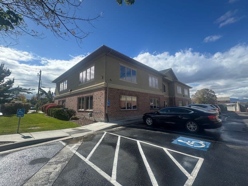 Building and parking with mountain views at 189 East Fort Union Boulevard in Midvale