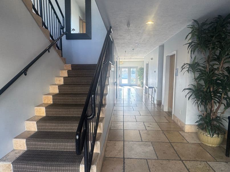Interior staircase and tile lobby at 189 East Fort Union Boulevard in Midvale