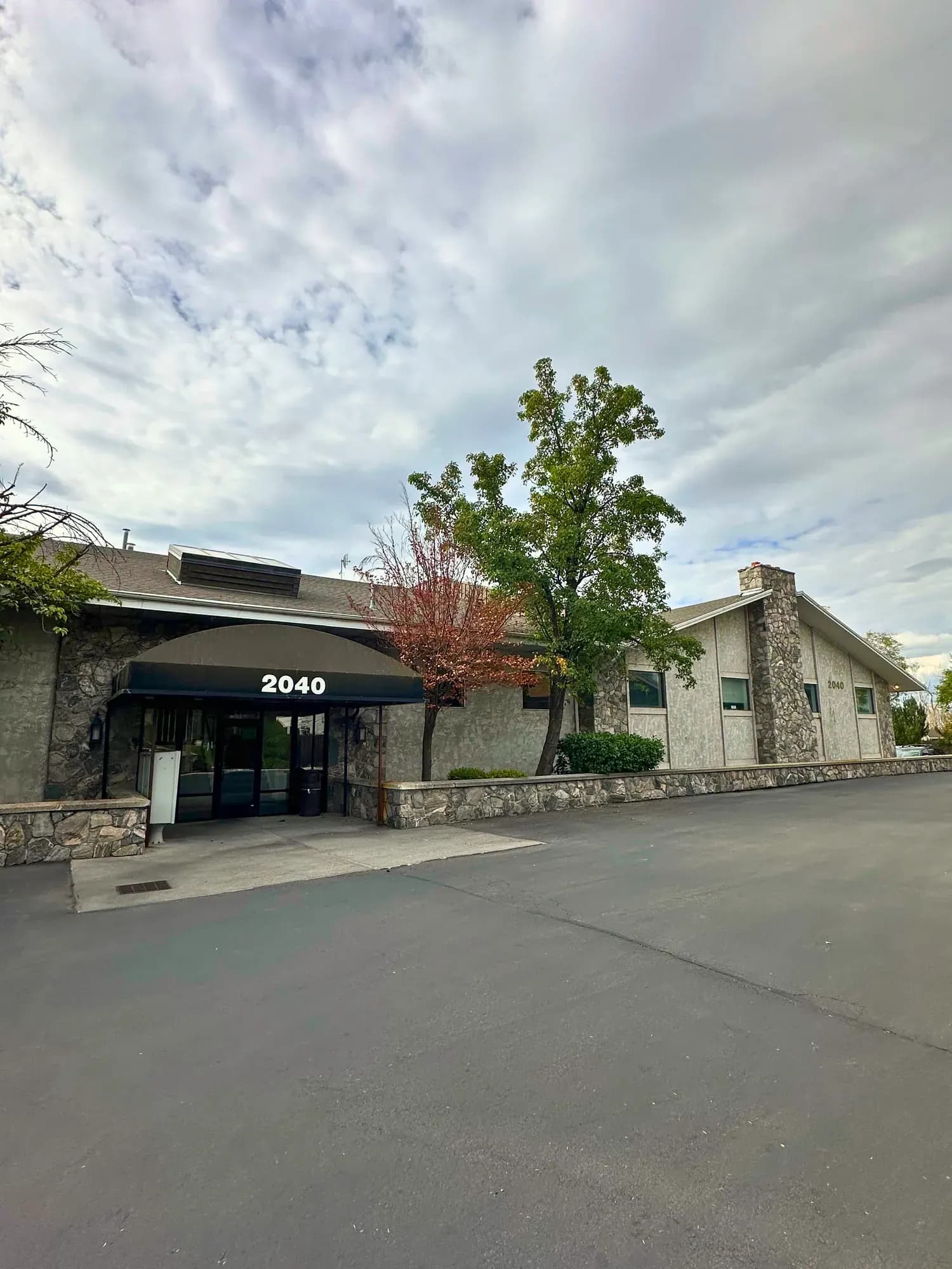 Entrance and stone facade at 2040 E Murray Holladay Road, Holladay