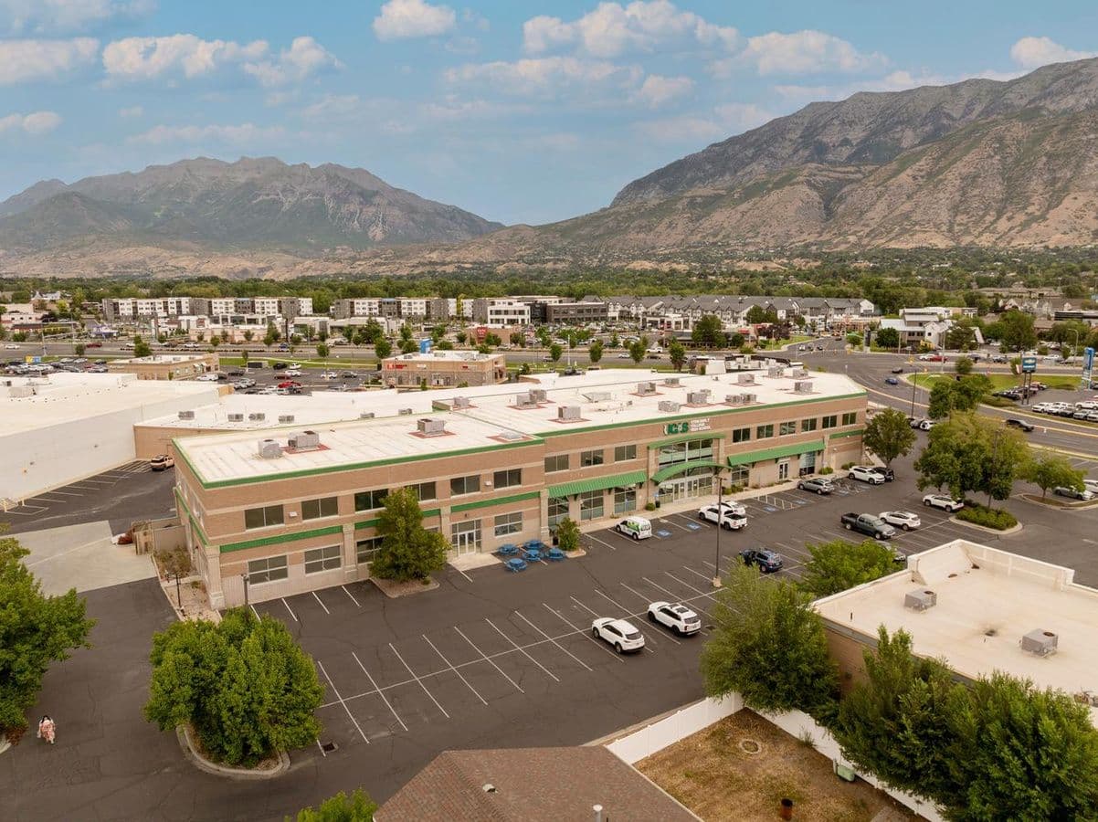 Aerial view of the 2121 North 550 West office building in Provo with mountain backdrop