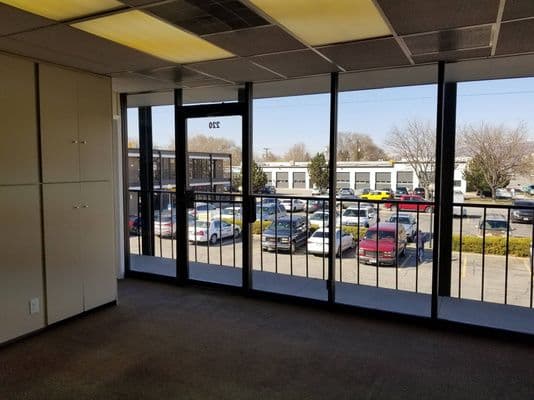 Corner suite with wraparound windows at 2880 South Main Street in Salt Lake City