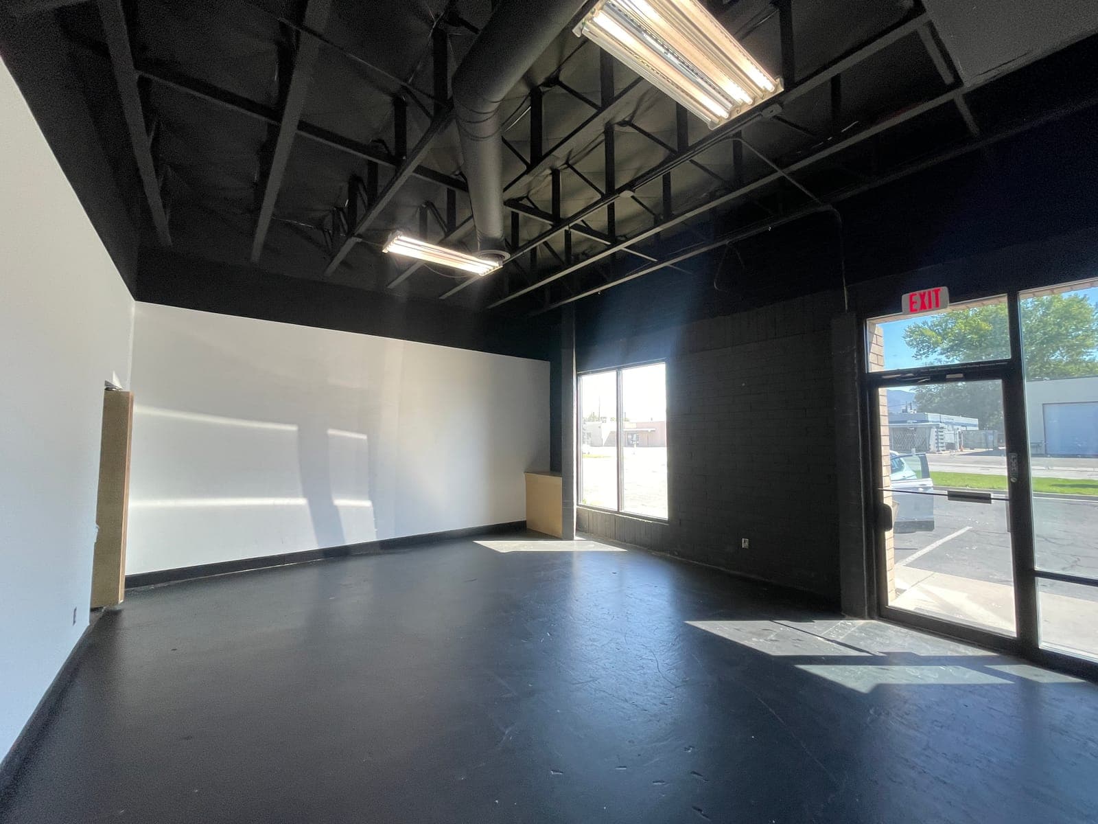 Front retail room with storefront glass at 2908 South West Temple in South Salt Lake