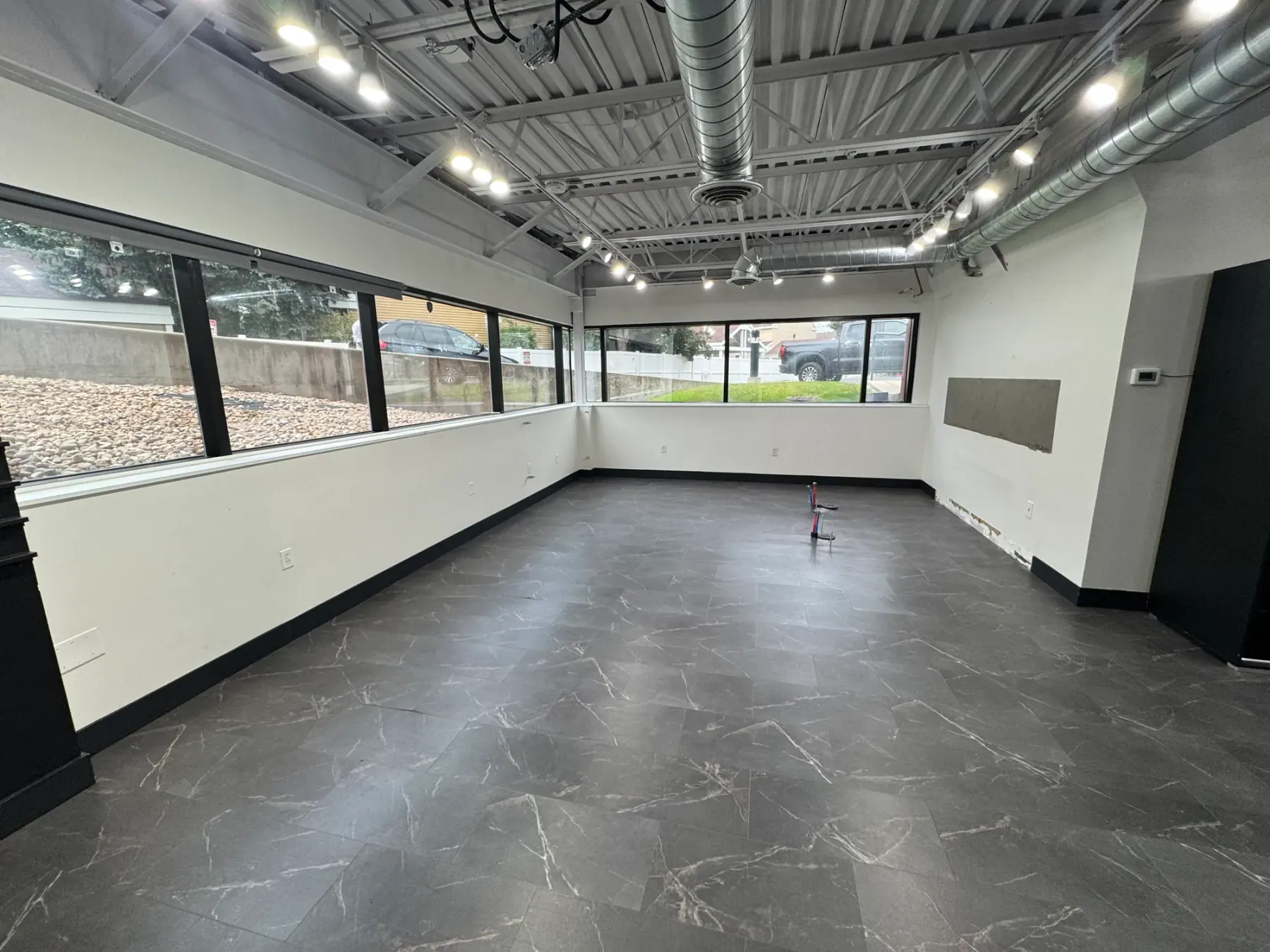 Open office with exposed ceiling at 807 E Fort Union Blvd, Midvale