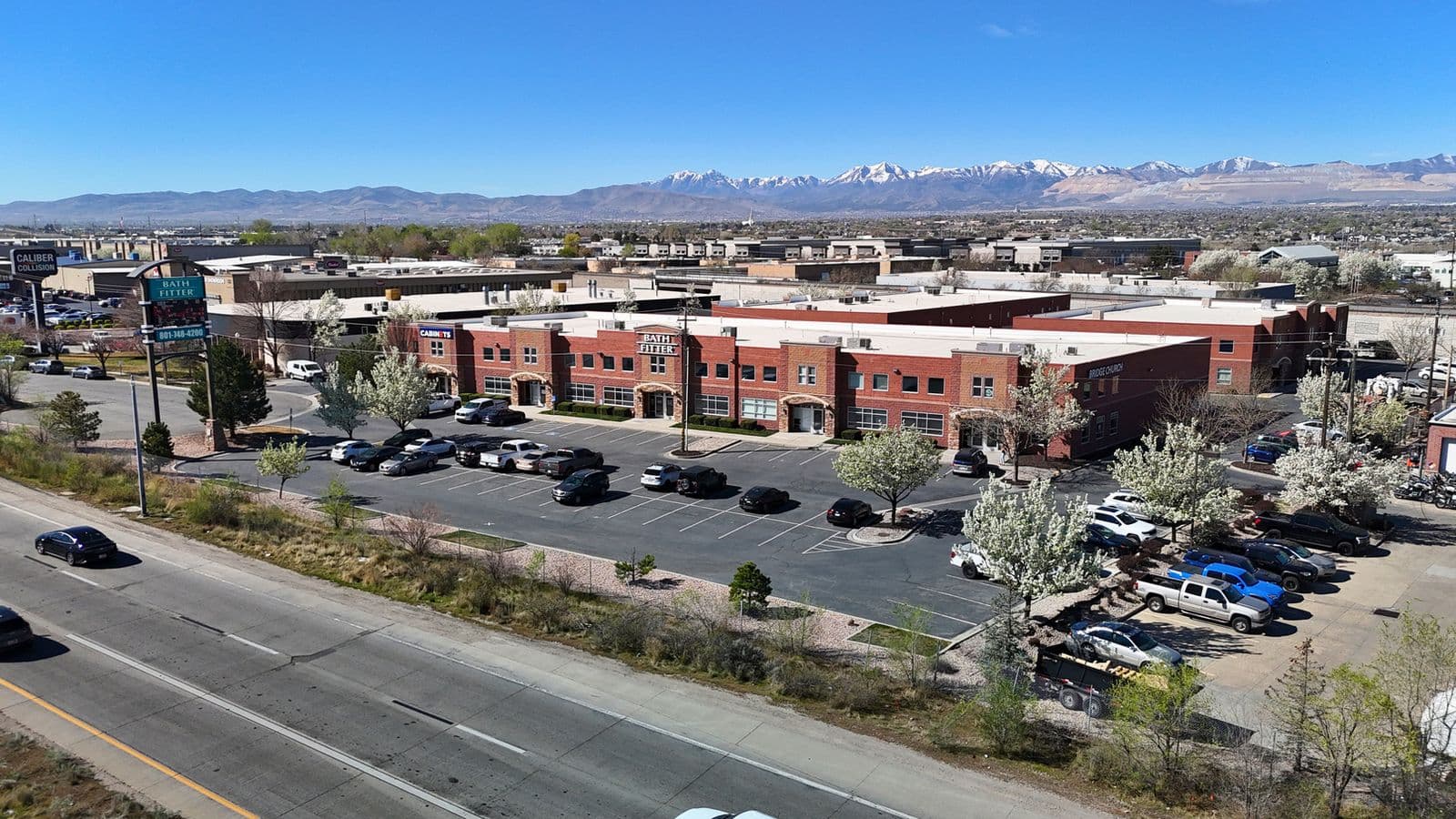 Aerial view of the red brick complex at 9070 S 300 West in Sandy